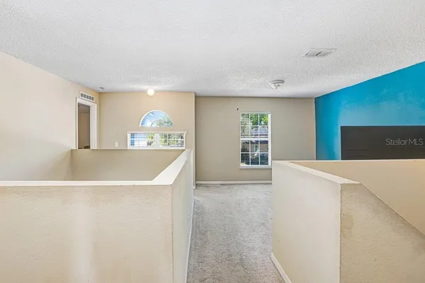 a view of a kitchen with furniture and a kitchen