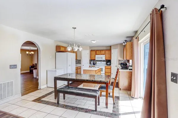 a view of a livingroom with furniture and a window