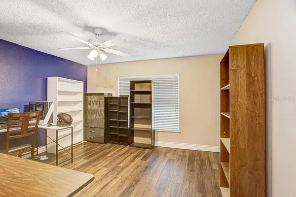 a view of a livingroom with wooden furniture
