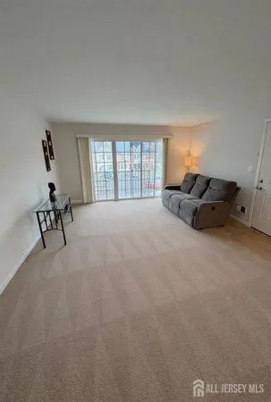 a living room with furniture window and a lamp