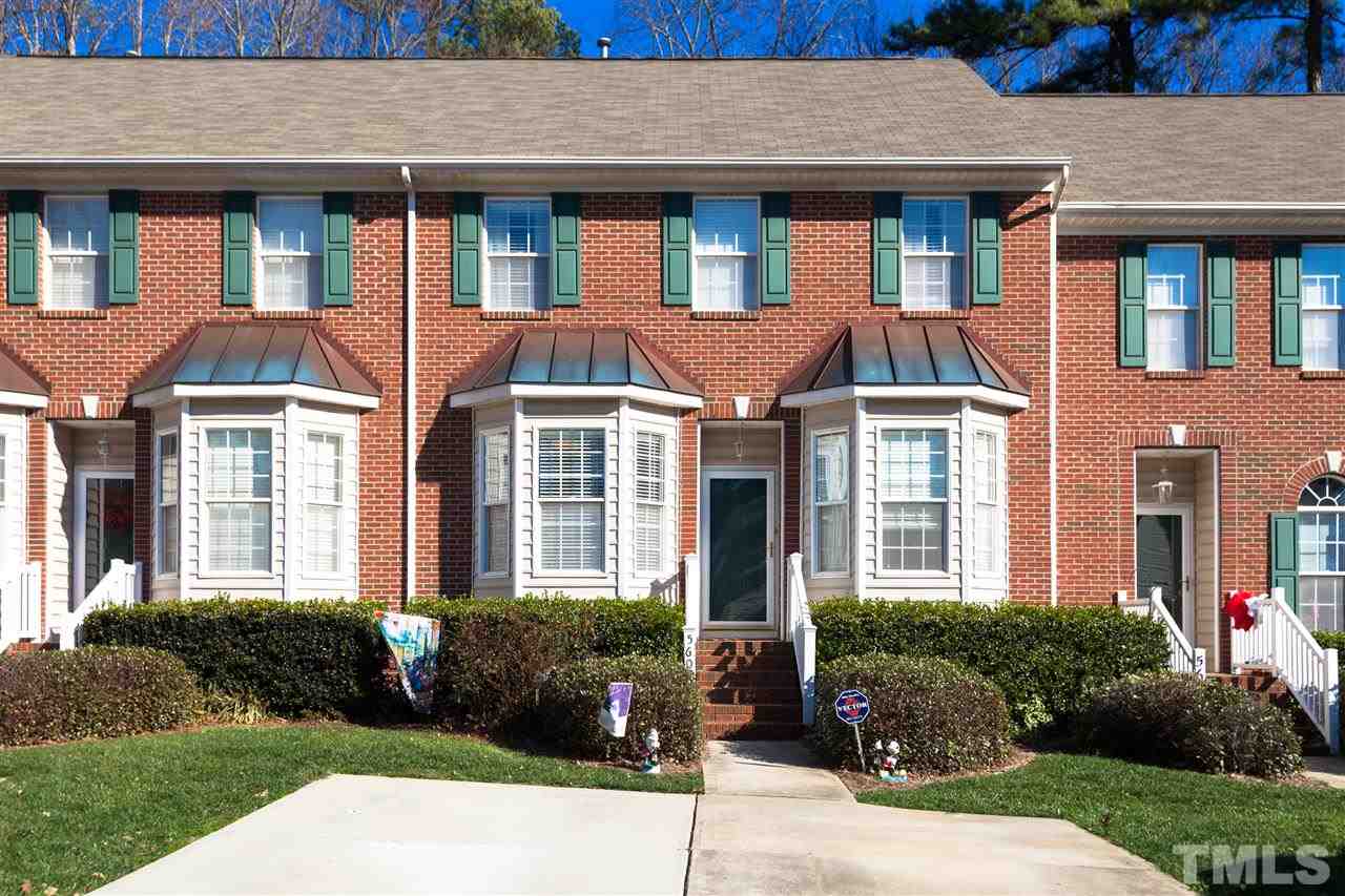 5602 Slide Rock Lane Raleigh, NC 27613 - Photo 1 of 19 a front view of a residential apartment building with a yard