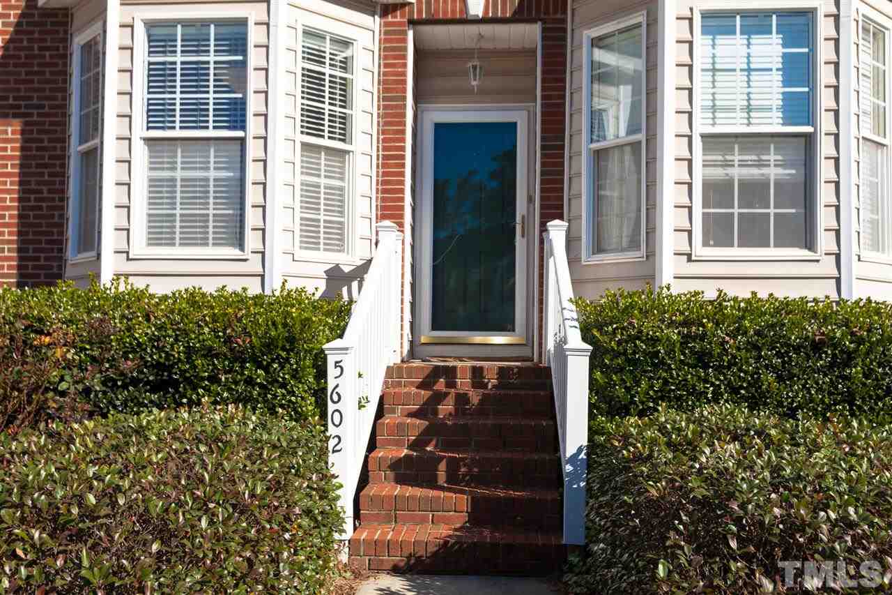5602 Slide Rock Lane Raleigh, NC 27613 - Photo 18 of 19 a view of front door and potted plants