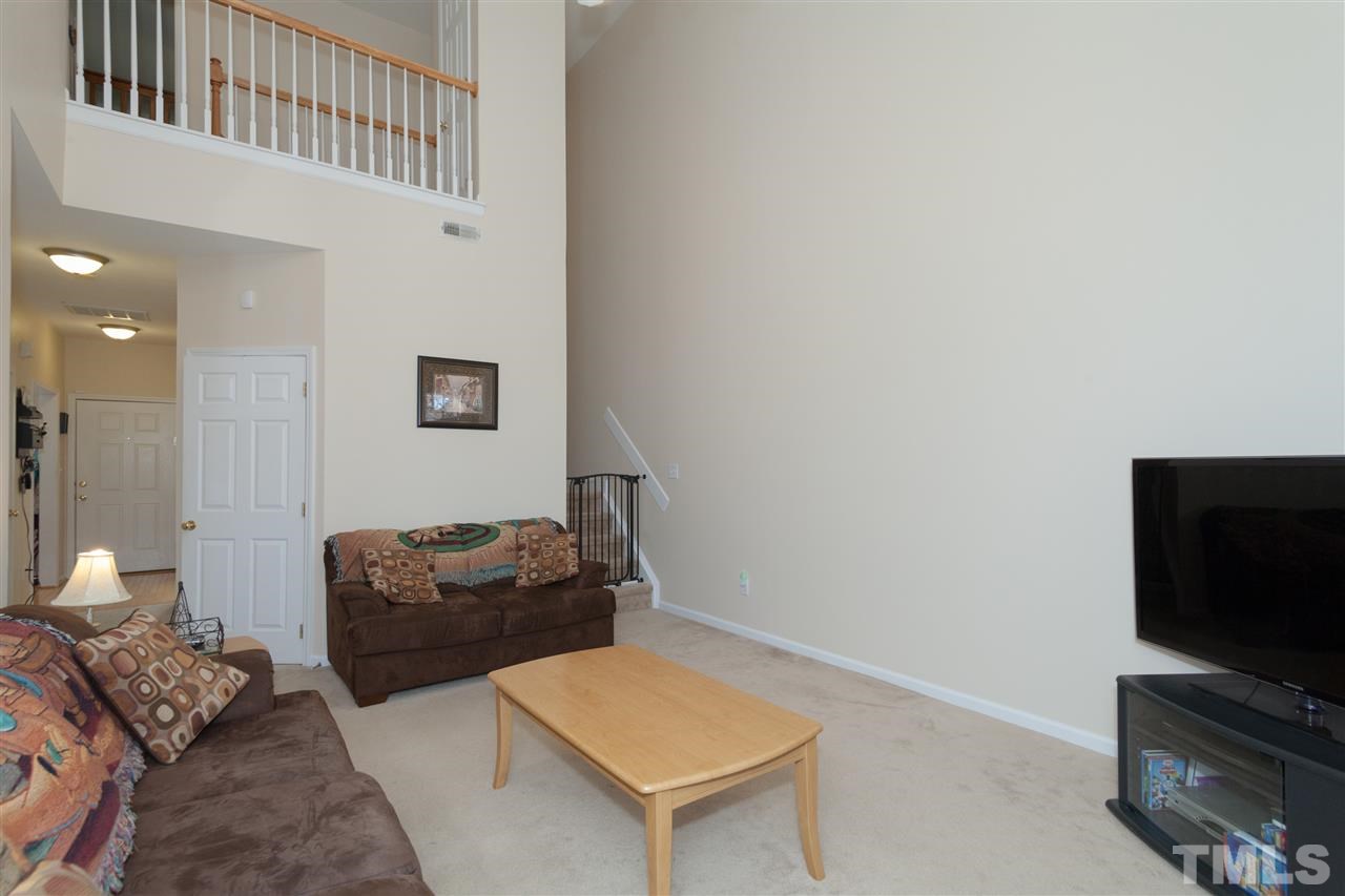 5602 Slide Rock Lane Raleigh, NC 27613 - Photo 9 of 19 a living room with furniture and a flat screen tv