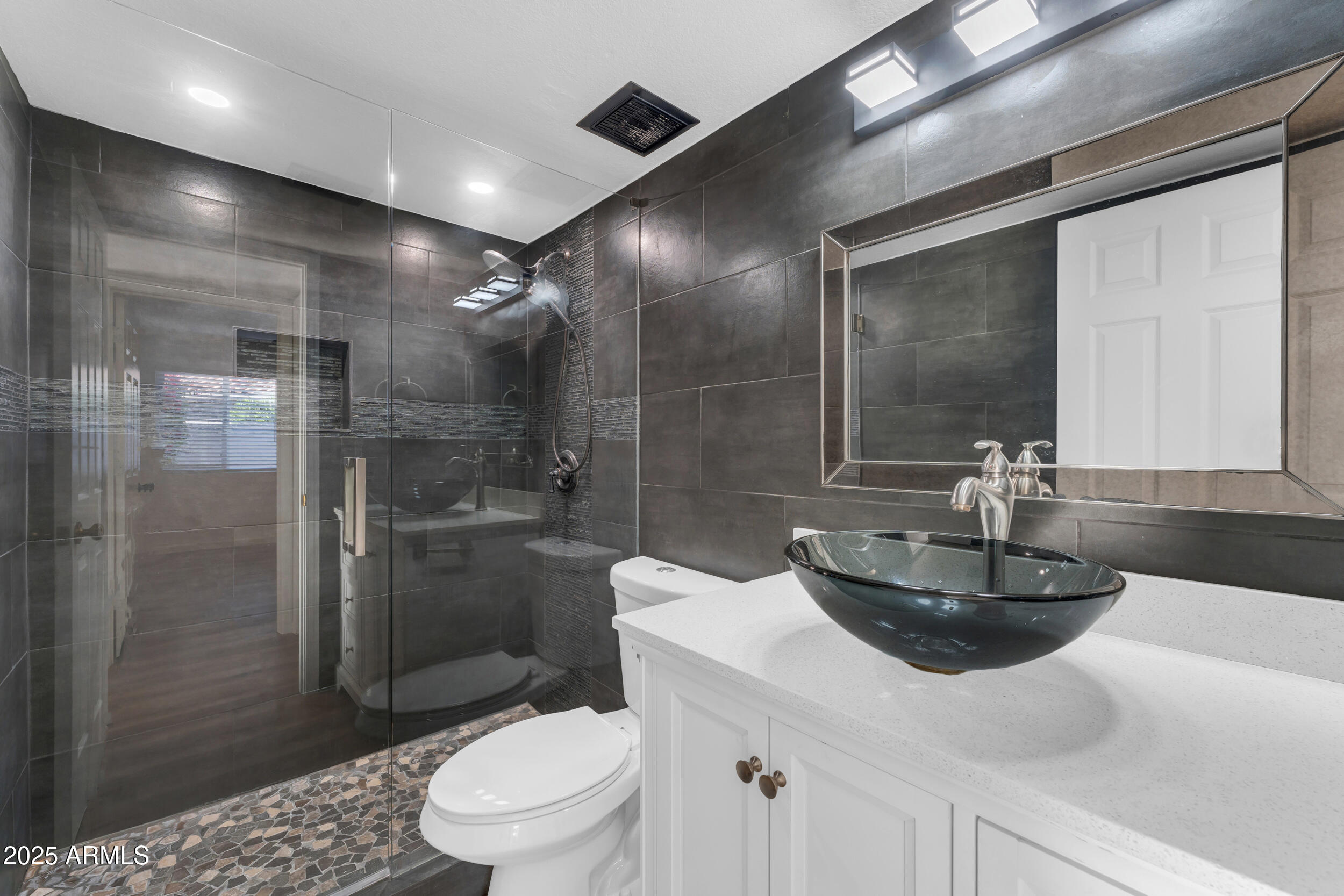 108 South Morning Ridge Drive Gilbert, AZ 85296 - Photo 13 of 49 a bathroom with a sink a toilet and shower