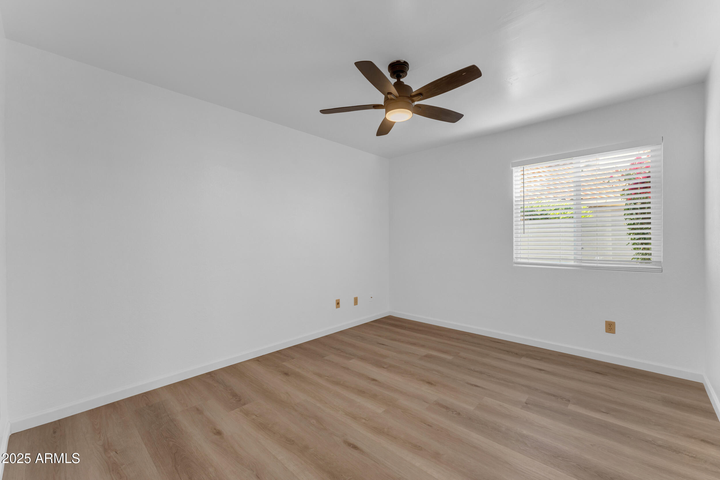 108 South Morning Ridge Drive Gilbert, AZ 85296 - Photo 14 of 49 a view of a big room with wooden floor and windows