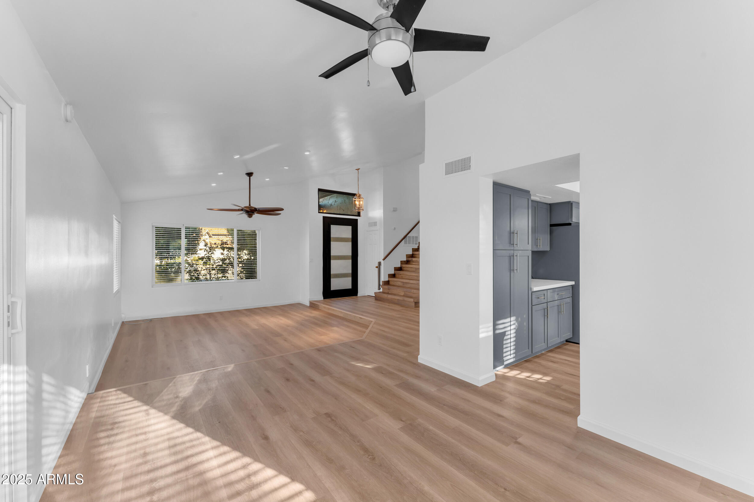 108 South Morning Ridge Drive Gilbert, AZ 85296 - Photo 21 of 49 a view of empty room with wooden floor