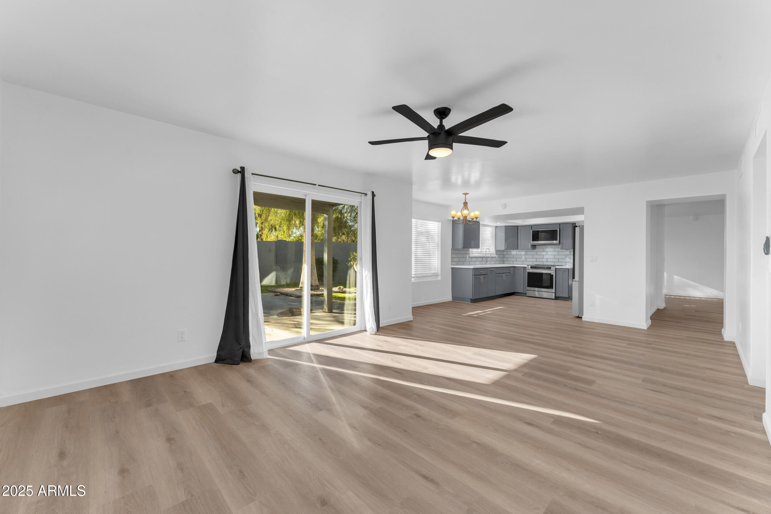 108 South Morning Ridge Drive Gilbert, AZ 85296 - Photo 22 of 49 a view of a livingroom with a furniture wooden floor and a large window