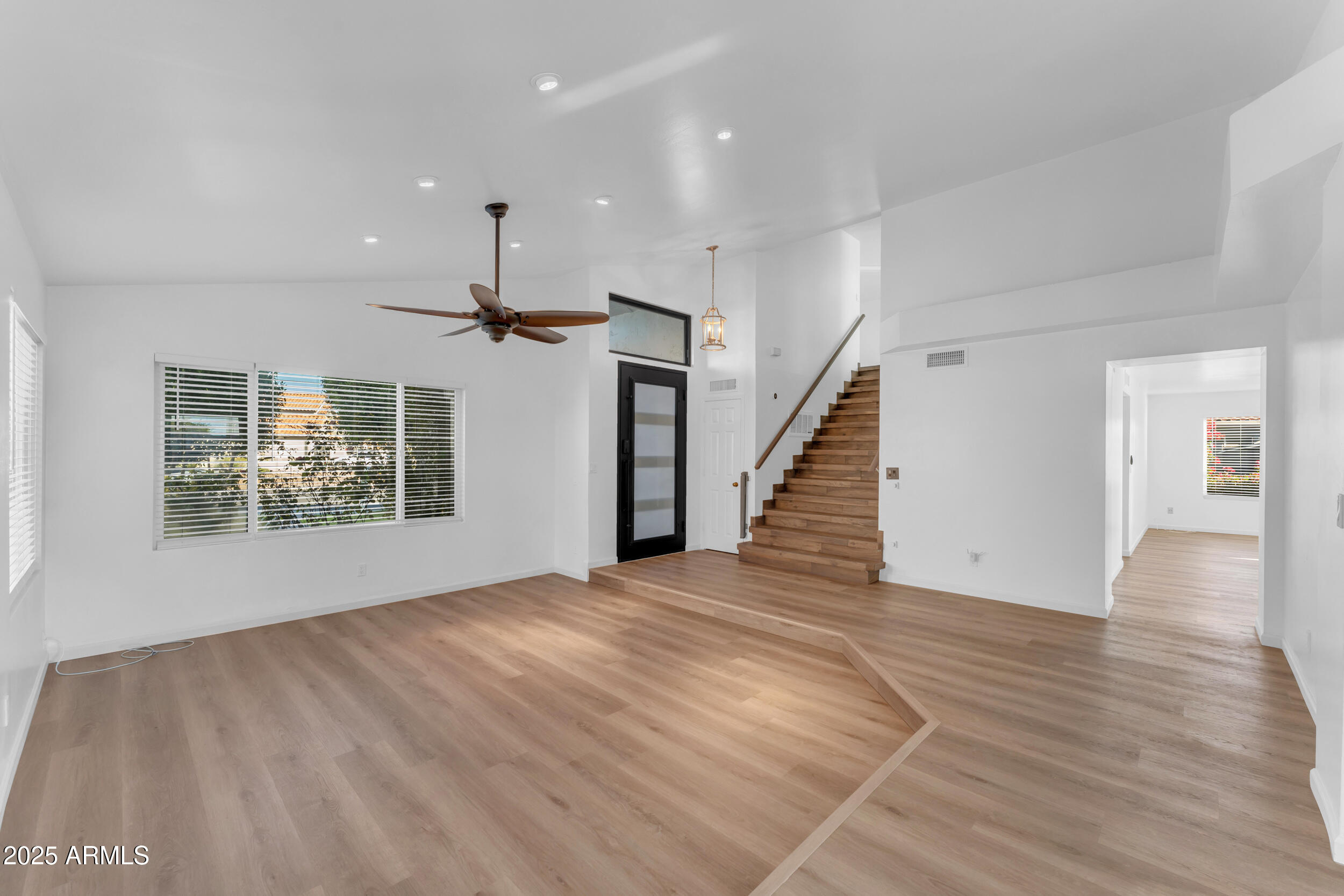 108 South Morning Ridge Drive Gilbert, AZ 85296 - Photo 24 of 49 wooden floor in an empty room with a window