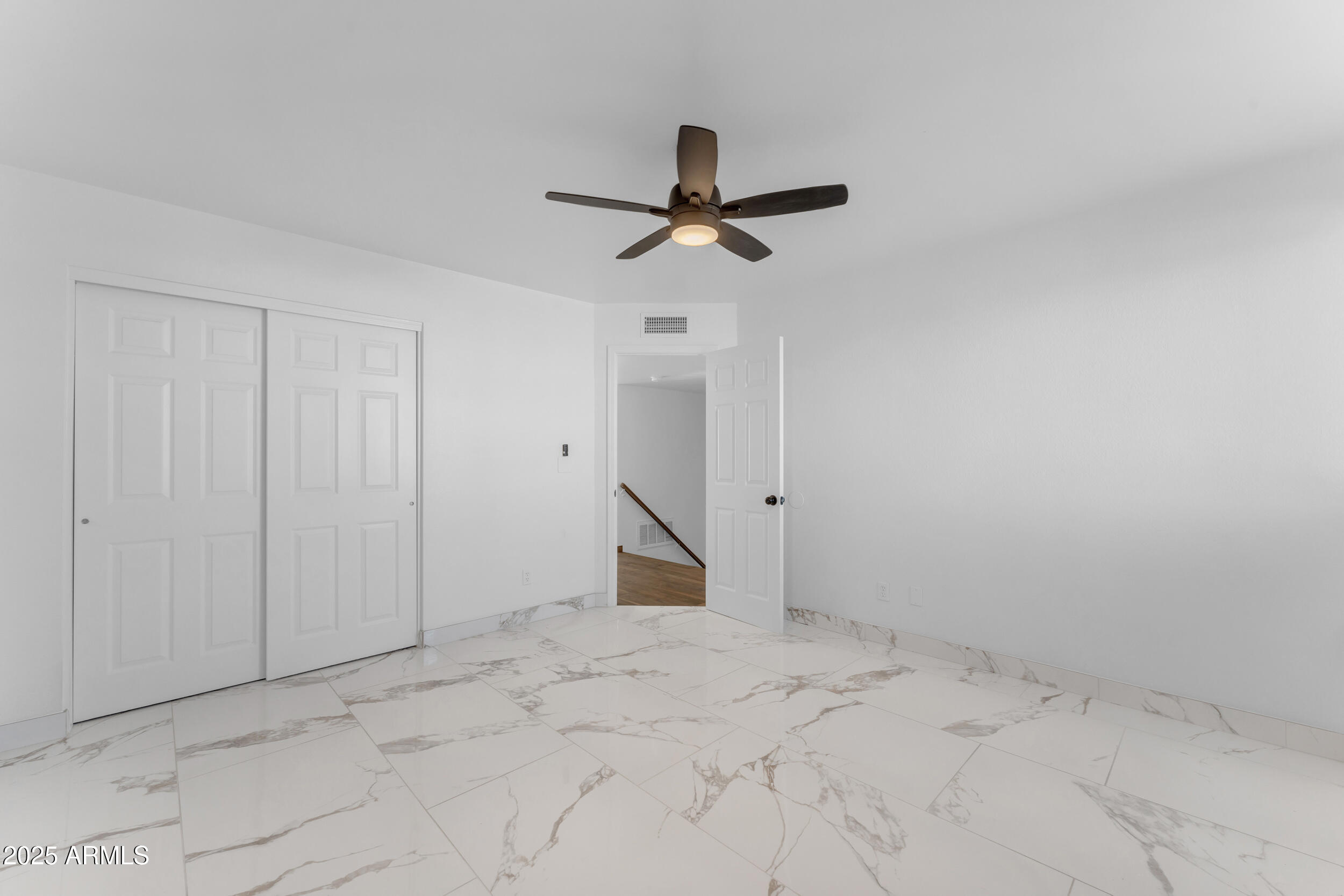 108 South Morning Ridge Drive Gilbert, AZ 85296 - Photo 25 of 49 en empty room with fan