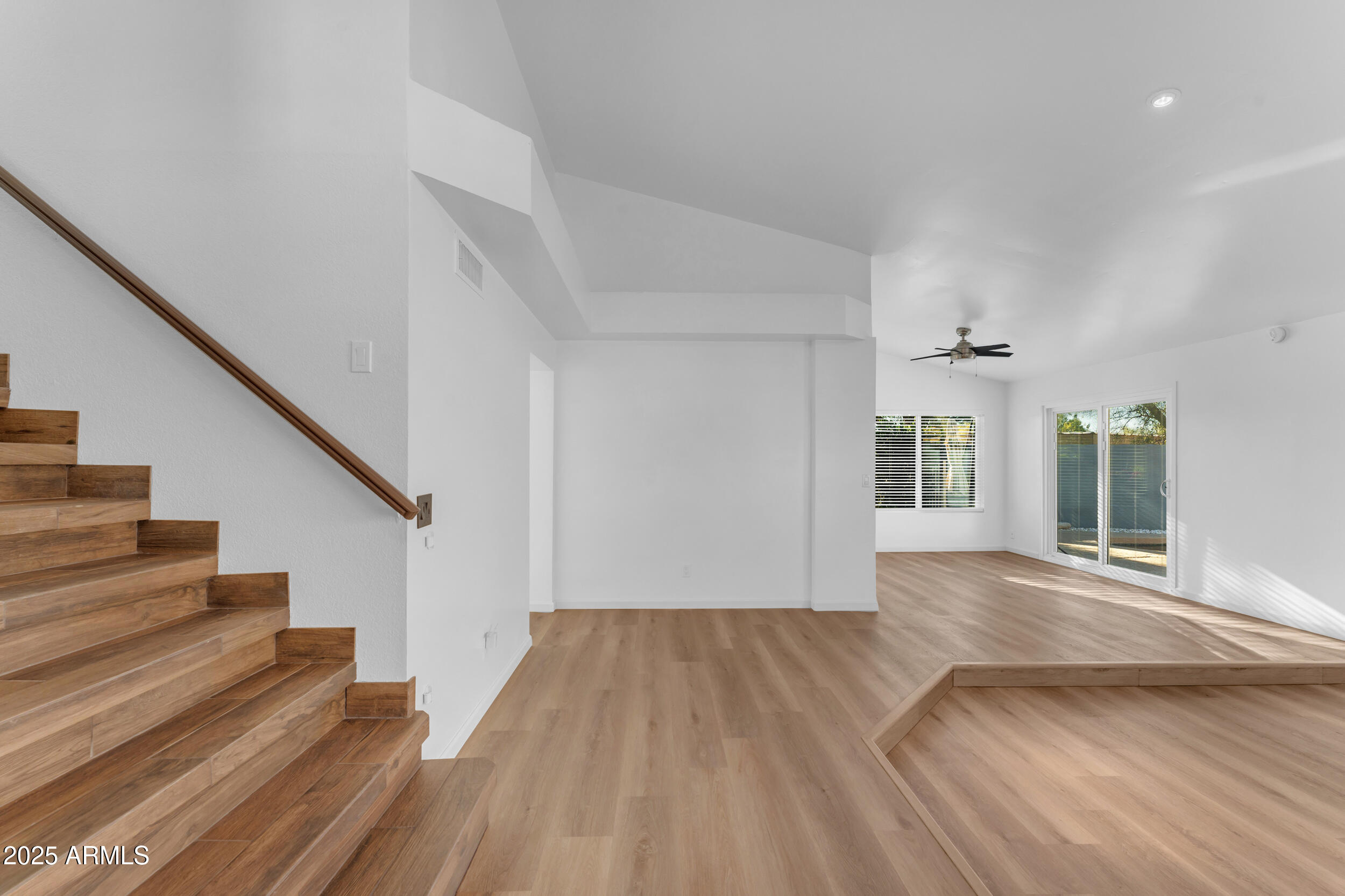 108 South Morning Ridge Drive Gilbert, AZ 85296 - Photo 28 of 49 a view of empty room with wooden floor and fan