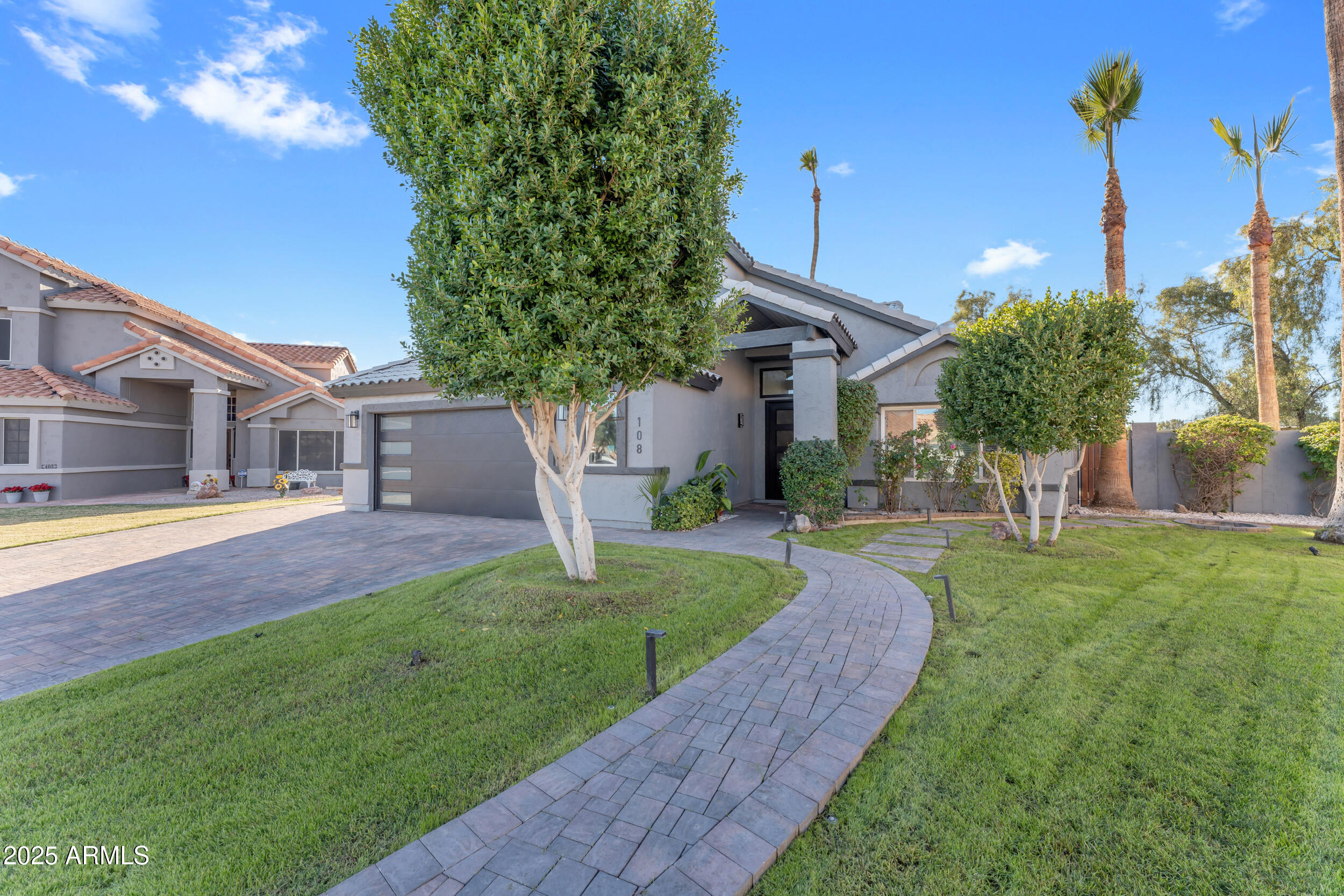 108 South Morning Ridge Drive Gilbert, AZ 85296 - Photo 3 of 49 a view of a house with a yard