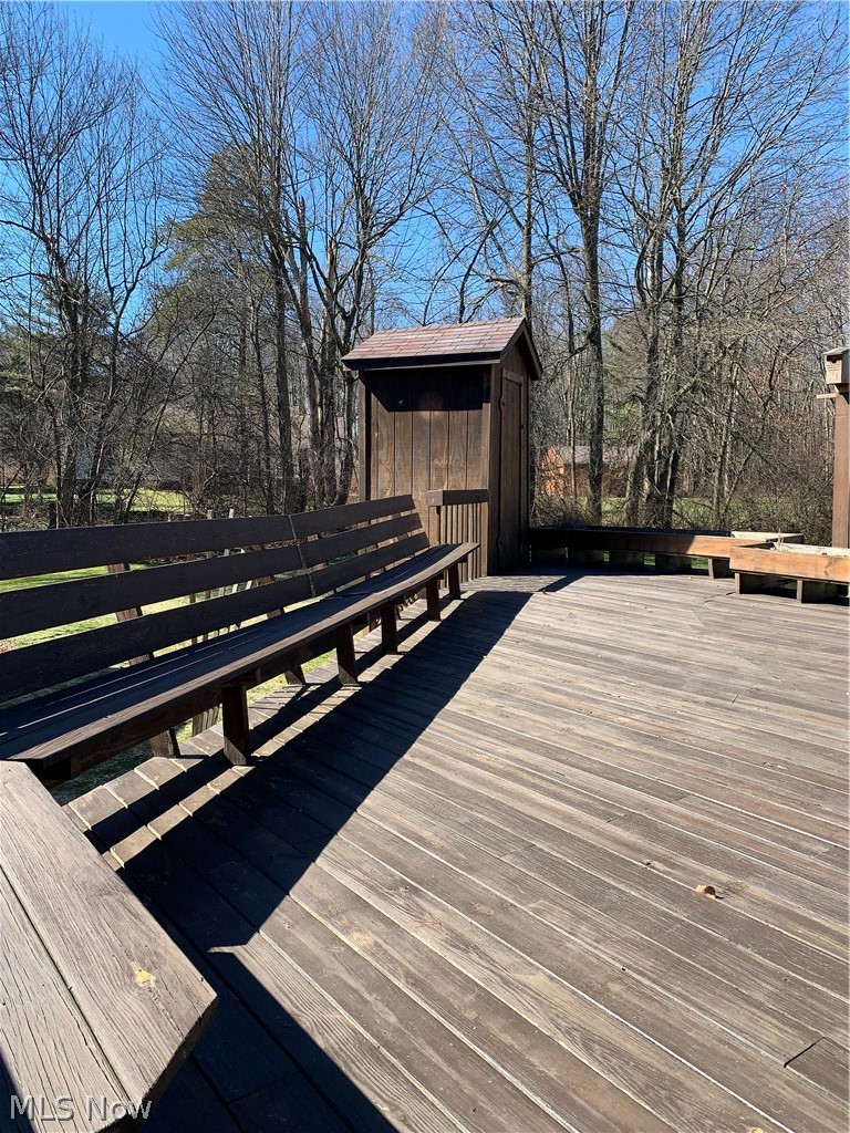 4789 West Bath Road Akron, OH 44333 - Photo 24 of 27 Deck with changing house for when pool was in front of deck. Now used for lounging chairs.