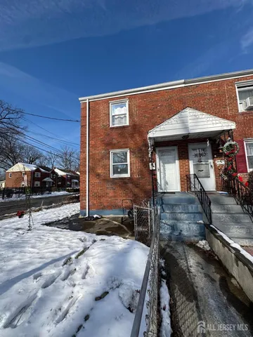 a front view of a house with parking