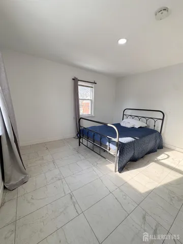 a room with a bed and a window