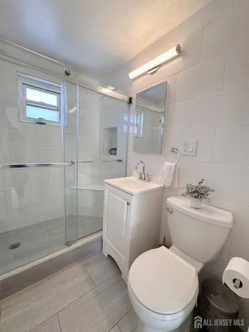 a bathroom with a toilet sink and shower
