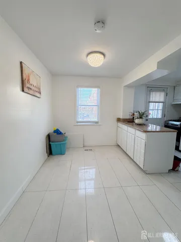 a view of a kitchen with an oven and cabinets