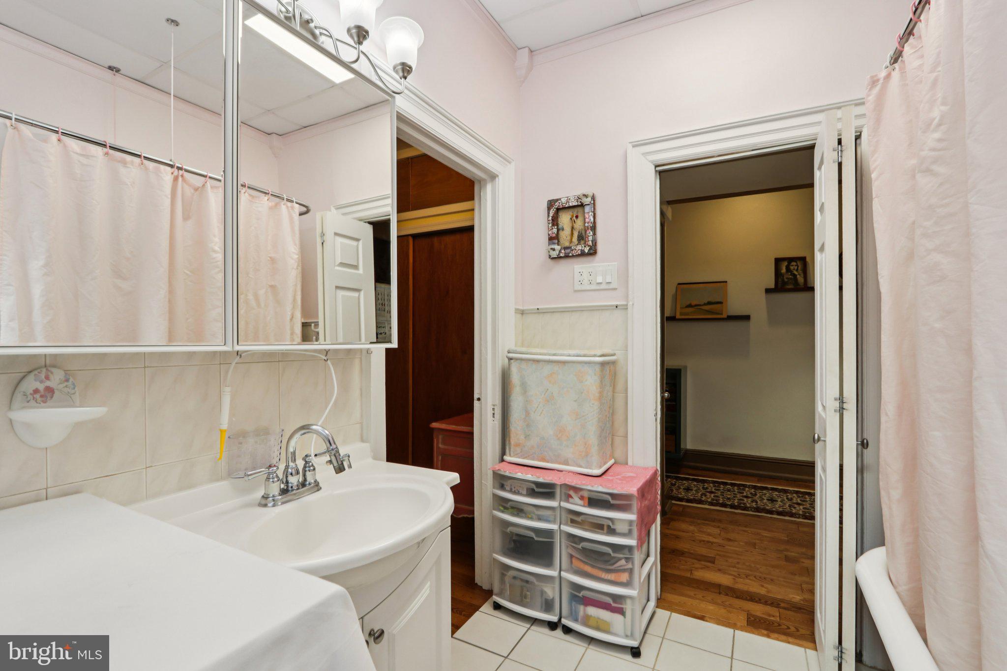 1003 South 46th Street, Unit 4 Philadelphia, PA 19143 - Photo 26 of 32 a bathroom with a sink toilet and shower