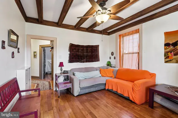 a bedroom with furniture and a large window