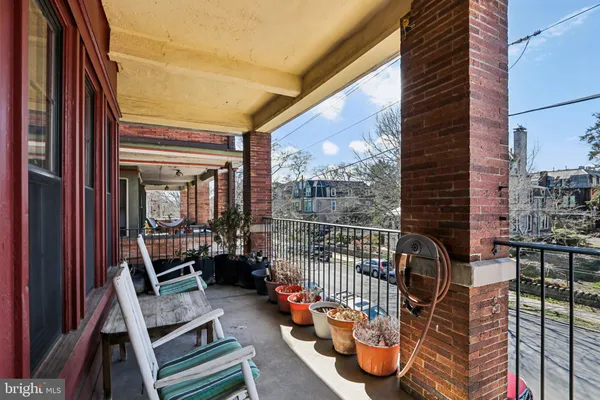 a view of two chairs in the patio