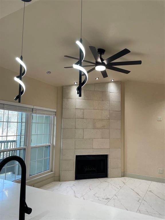 4103 Esters Road, Unit 204 Irving, TX 75038 - Photo 1 of 1 Details with a tiled fireplace, recessed lighting, a ceiling fan, and baseboards