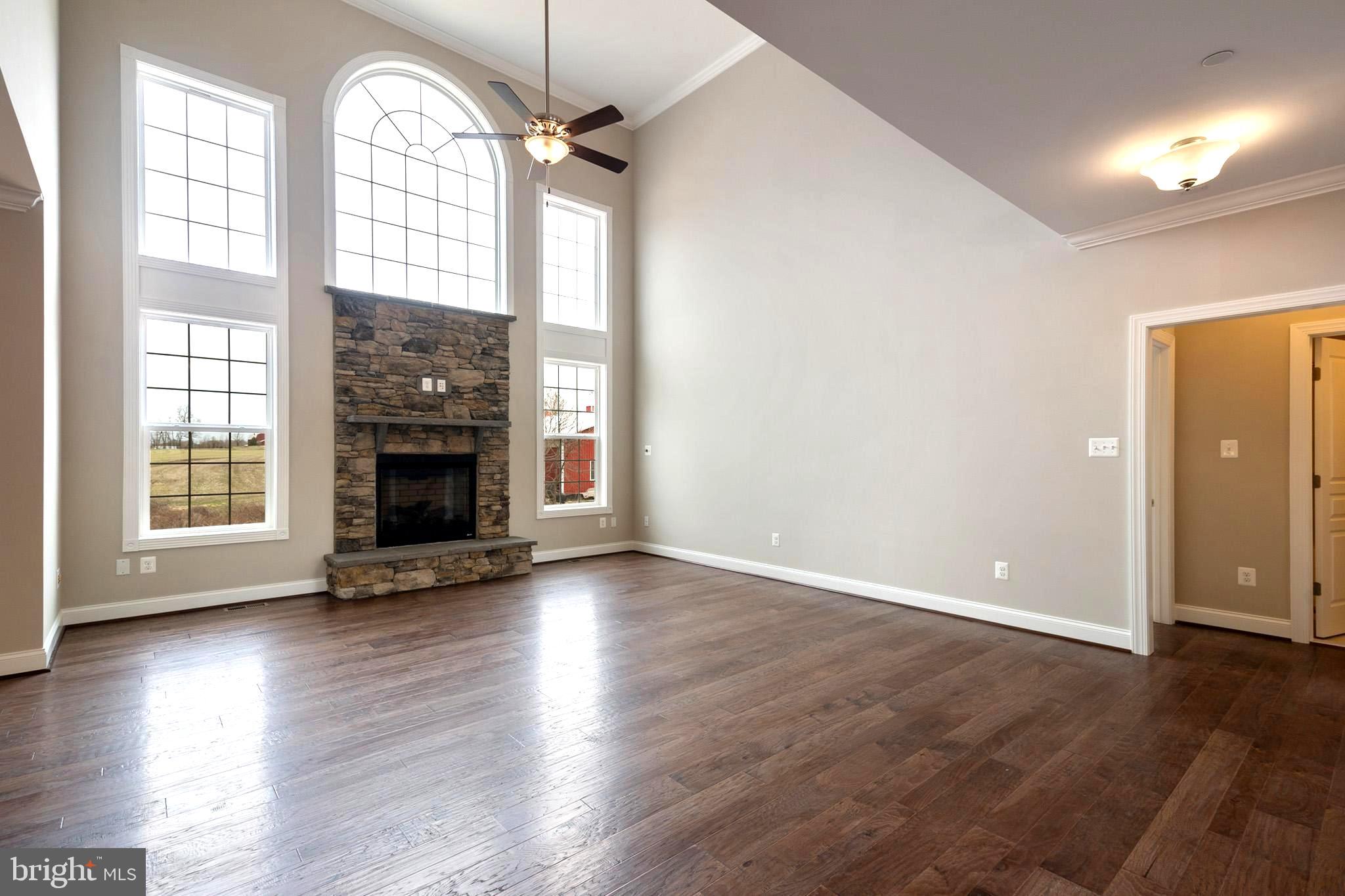 622 West Bay Front Road Lothian, MD 20711 - Photo 26 of 34 STONE FIREPLACE AND A 2 STORY CEILING