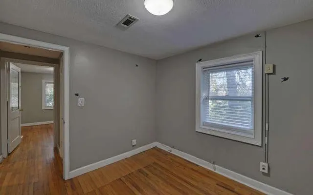 a bathroom with a sink vanity and a mirror
