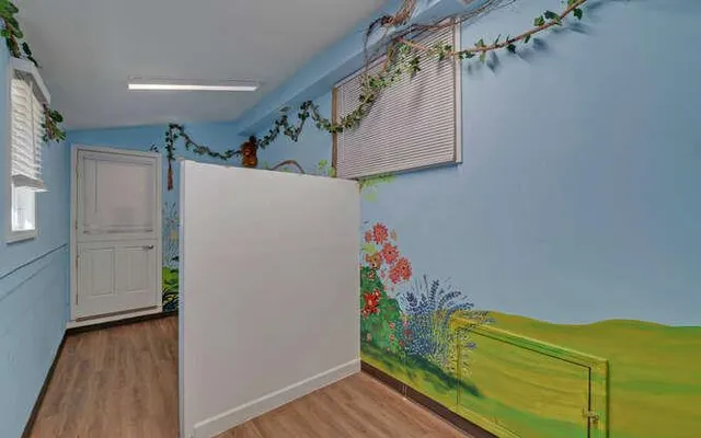 a view of hallway with wooden floor