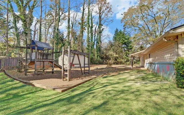 a backyard of a house with lots of green space