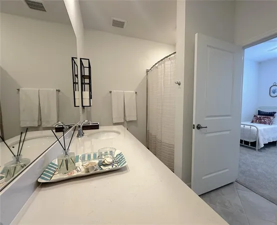 a view of a bedroom with a large bed and a couch