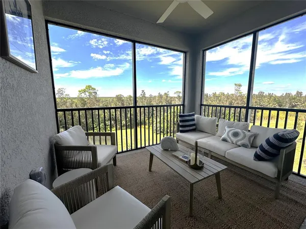 a balcony with couch and city view