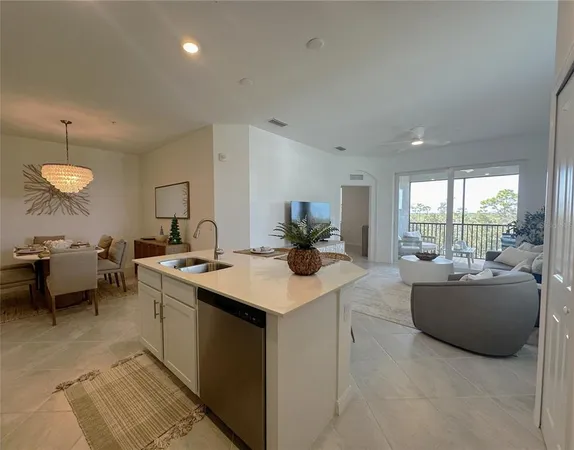 a room with a large window and furniture