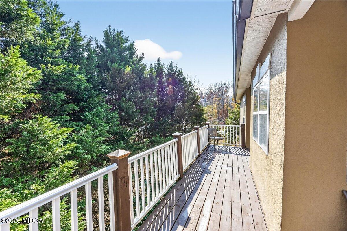 518 River Overlook Forsyth, GA 31029 - Photo 61 of 96 a view of a balcony with wooden floor and fence