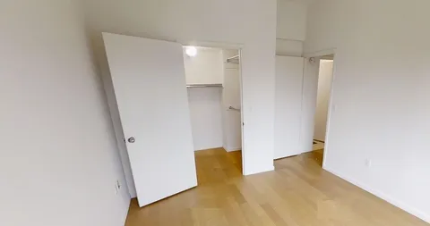 a bathroom with a glass shower door