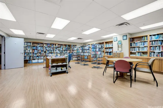 a living room with furniture a dining table and chairs