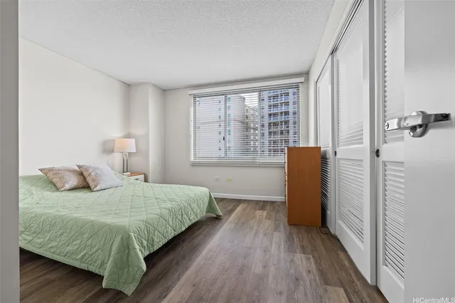 a large white bed in a white room