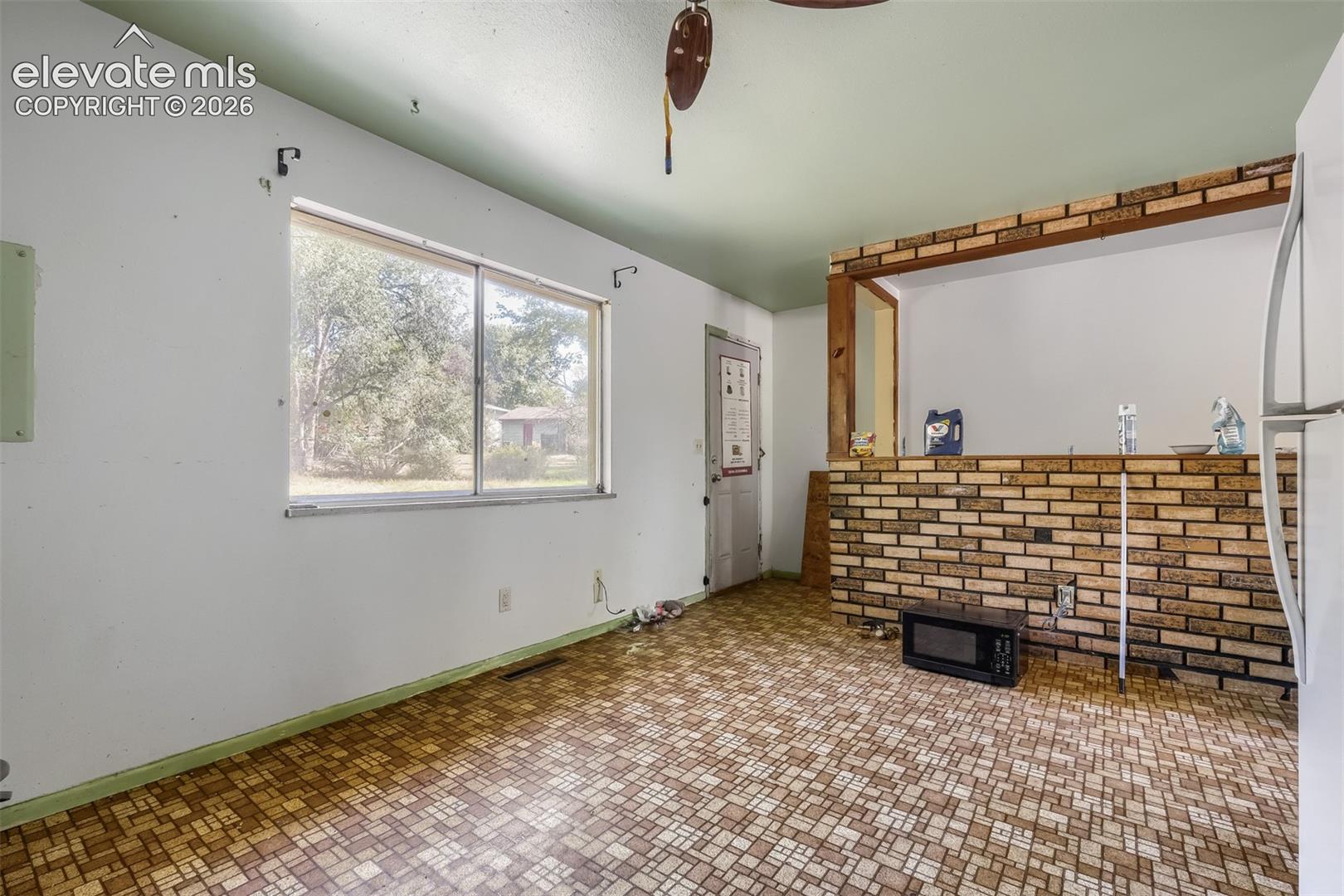 4040 Hollow Road Colorado Springs, CO 80917 - Photo 5 of 11 Looking from the cupboards to back door