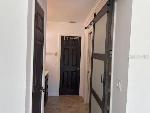 a bathroom with a glass shower door