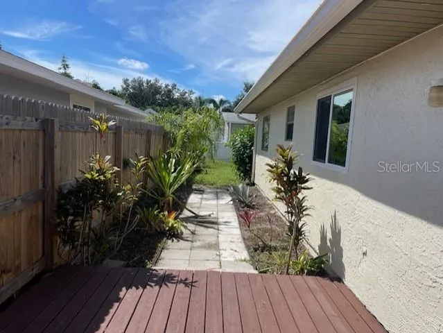 a view of a backyard of the house