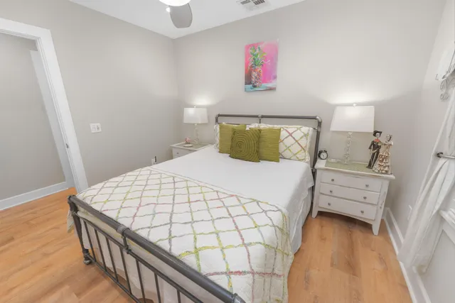 a bedroom with a bed and flat screen tv