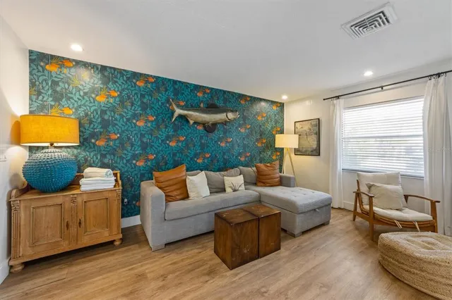 a living room with furniture and a large window