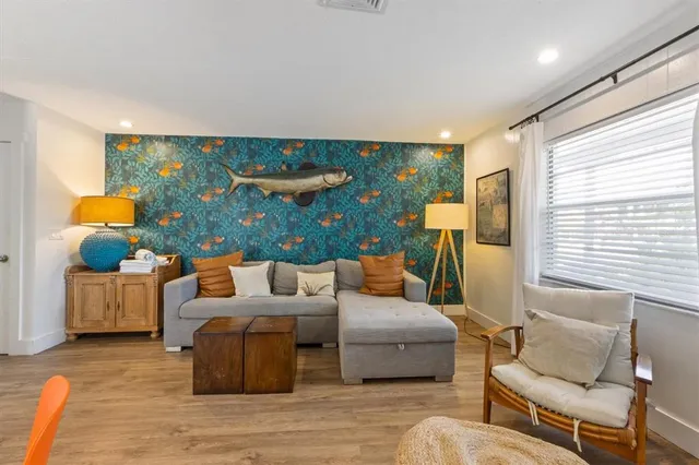 a living room with furniture and a large window