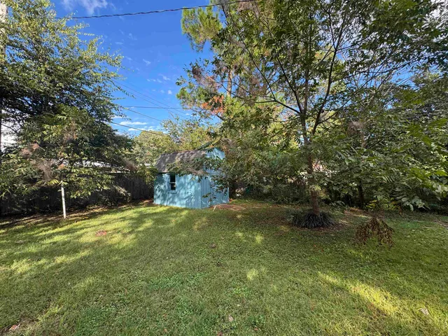 a backyard of a house with lots of green space