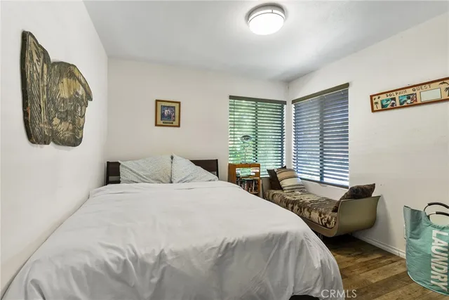 a bedroom with bed and window