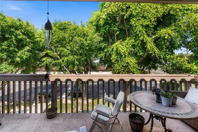 a view of a chairs and table in the backyard