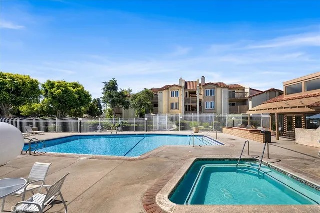 a view of a swimming pool with a lounge chairs