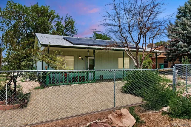a view of a house with a small yard