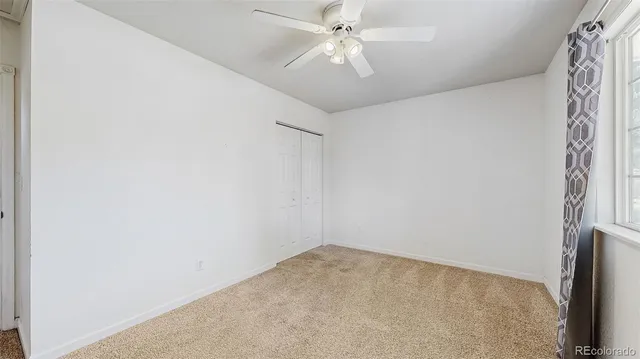 a bathroom with a sink toilet vanity and shower
