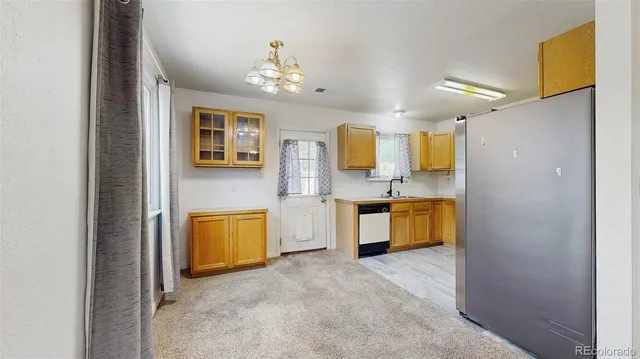 an empty room with a ceiling fan and window