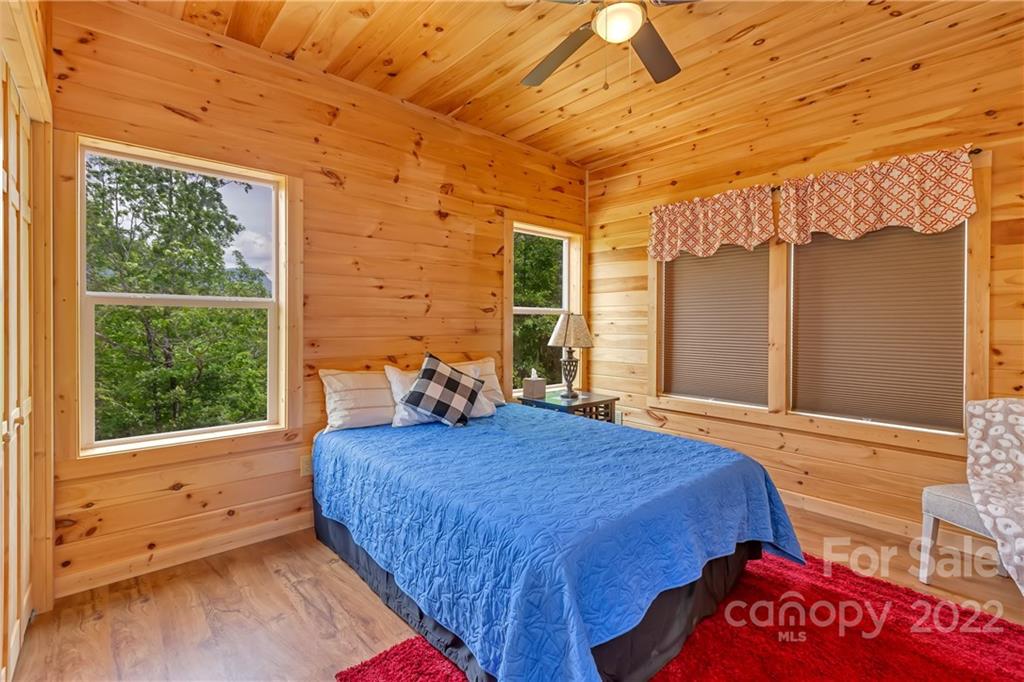 1299 Fox Rdg Trail Marion, NC 28752 - Photo 12 of 23 a bedroom with a bed and wooden floor