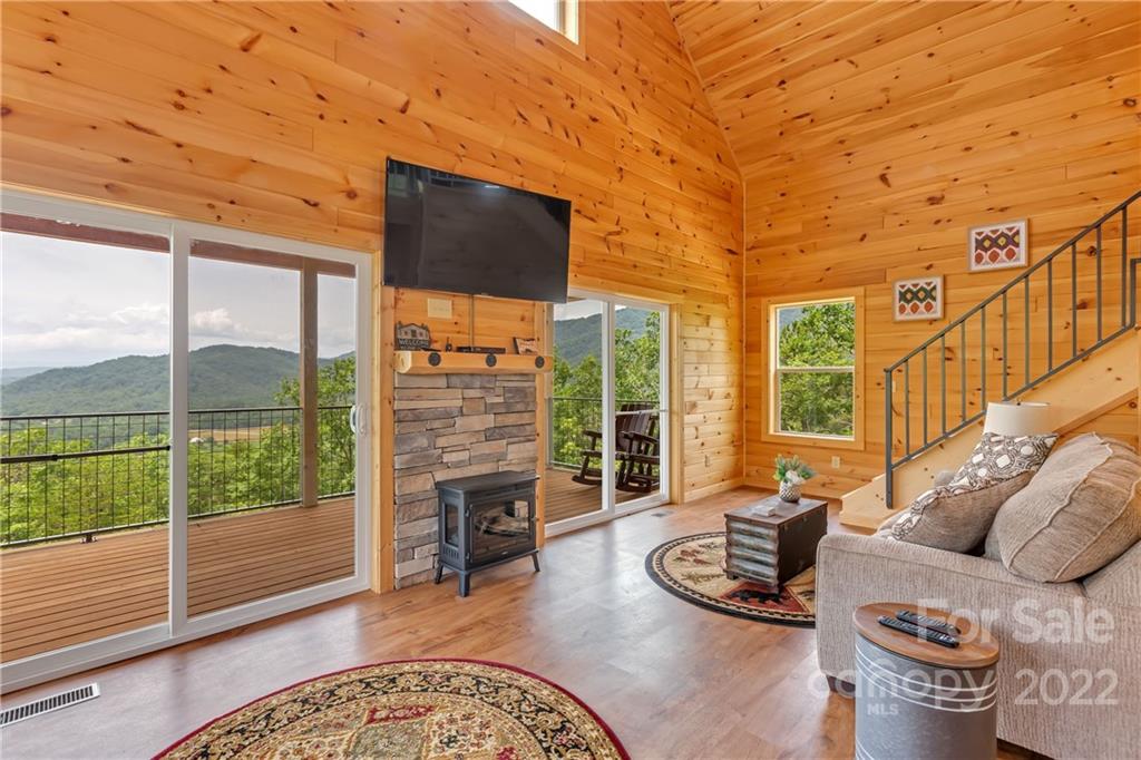 1299 Fox Rdg Trail Marion, NC 28752 - Photo 7 of 23 a living room with furniture floor to ceiling window and floor to ceiling window
